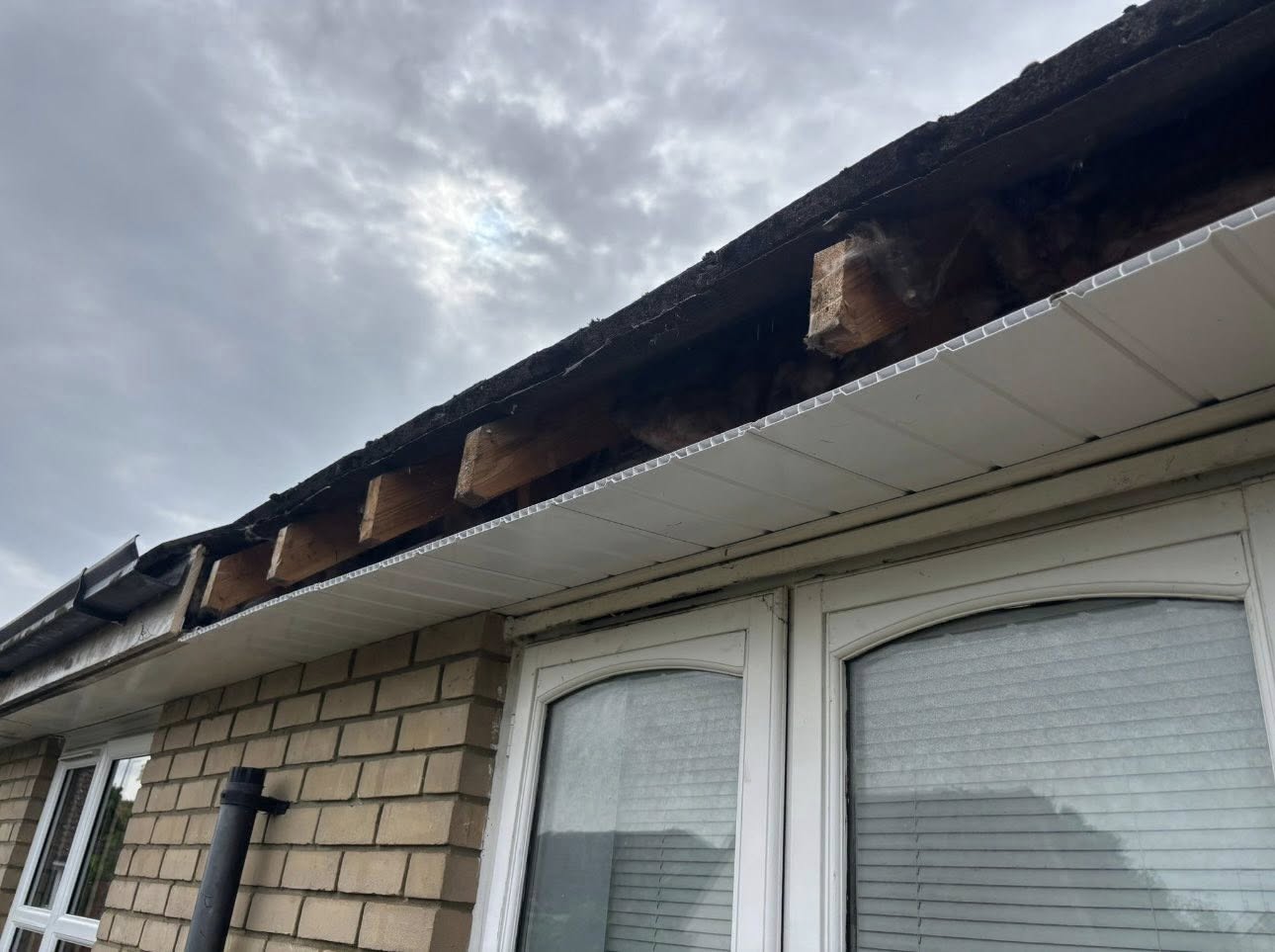 Black fascia run along a bay window