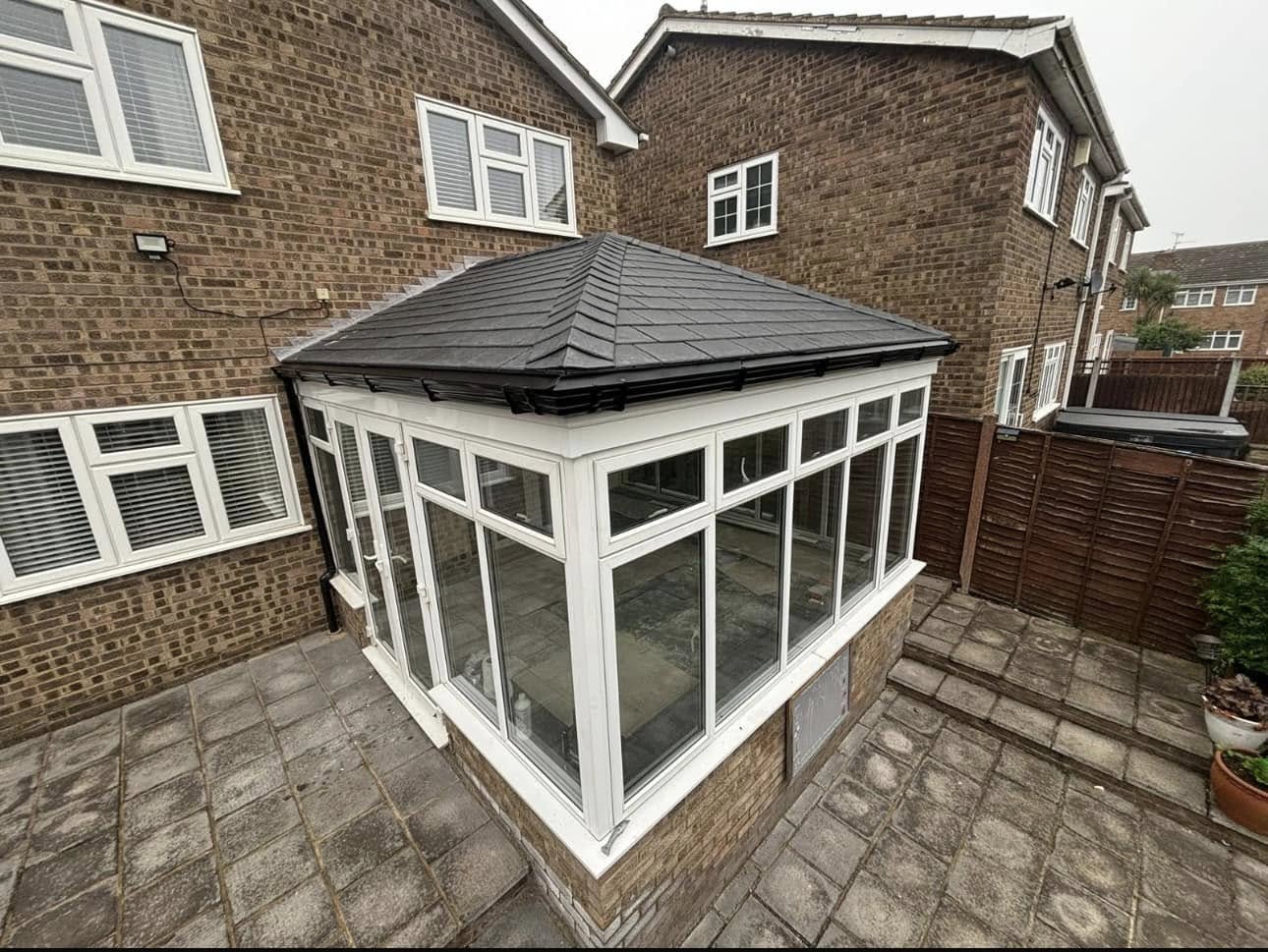 Edwardian conservatory with black tiled warm roof