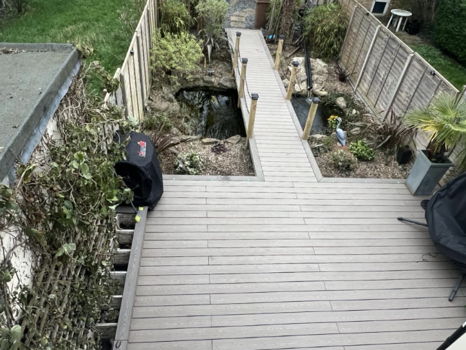 Composite deck and lit pathway at dusk