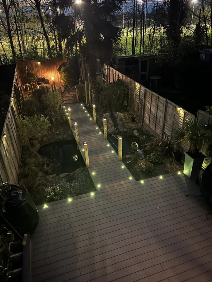 Composite deck with festoon lighting at night
