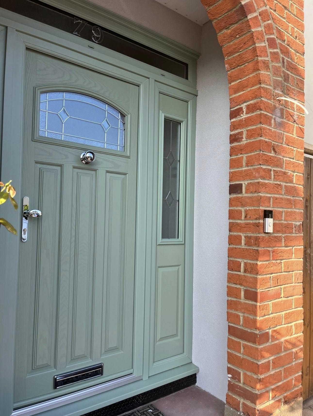 Chartwell green composite front door with side panel and decorative glazing
