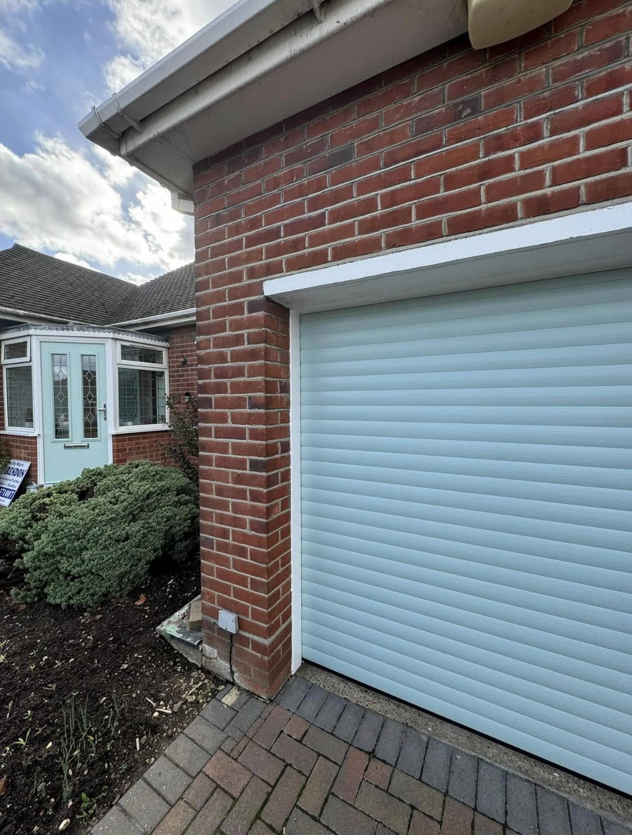 White roller garage door, side elevation