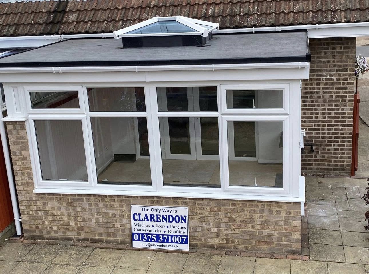 White orangery with central roof lantern on a Clarendon project