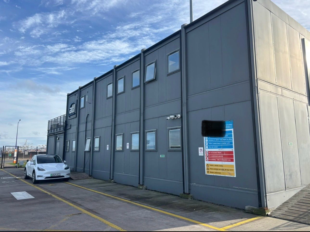 Grey clad two-storey commercial modular building with multiple windows